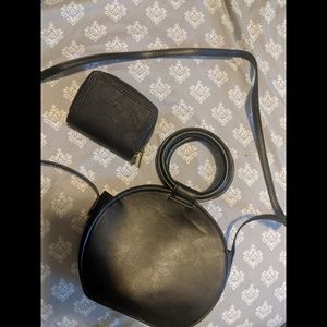 Black round crossbody bag with double sided wallet